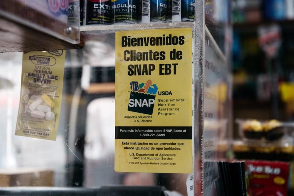 A sign alerting customers about SNAP food stamps benefits is displayed in a Brooklyn grocery store on December 5, 2019 in New York City. Earlier this week the Trump Administration announced stricter requirements for food stamps benefits that would cut support for nearly 700,000 poor Americans. (Photo by Scott Heins/Getty Images)