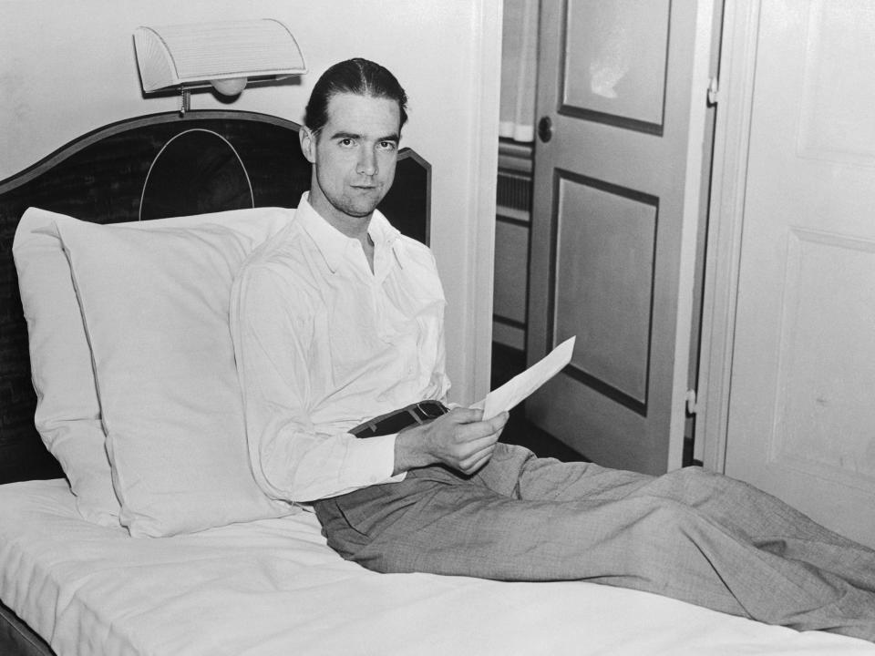 Howard Hughes resting on a bed in 1936.