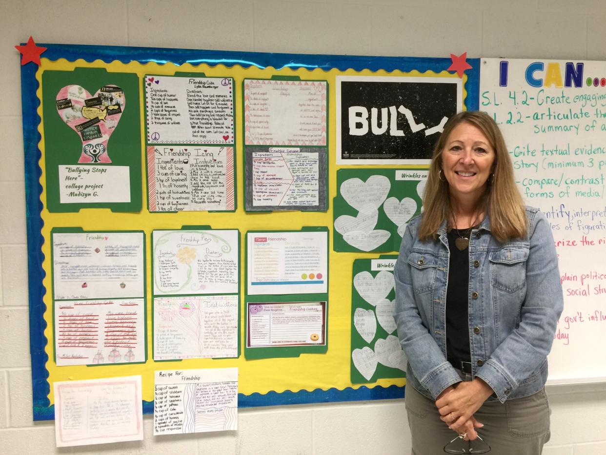 Rebekah Hodge poses with the bulletin board displaying some of the materials from CYPRESS’ anti-bullying campaign HEART in 2015. Hodge presented CYPRESS’ anti-bullying project dubbed HEART to a worldwide audience at the National Association for Gifted Children in Phoenix, Arizona.