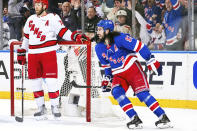 New York Rangers center Mika Zibanejad, right, celebrates after his goal as Carolina Hurricanes defenseman Jaccob Slavin (74) looks on during the first period in Game 1 of an NHL hockey Stanley Cup second-round playoff series, Sunday, May 5, 2024, in New York. (AP Photo/Julia Nikhinson)