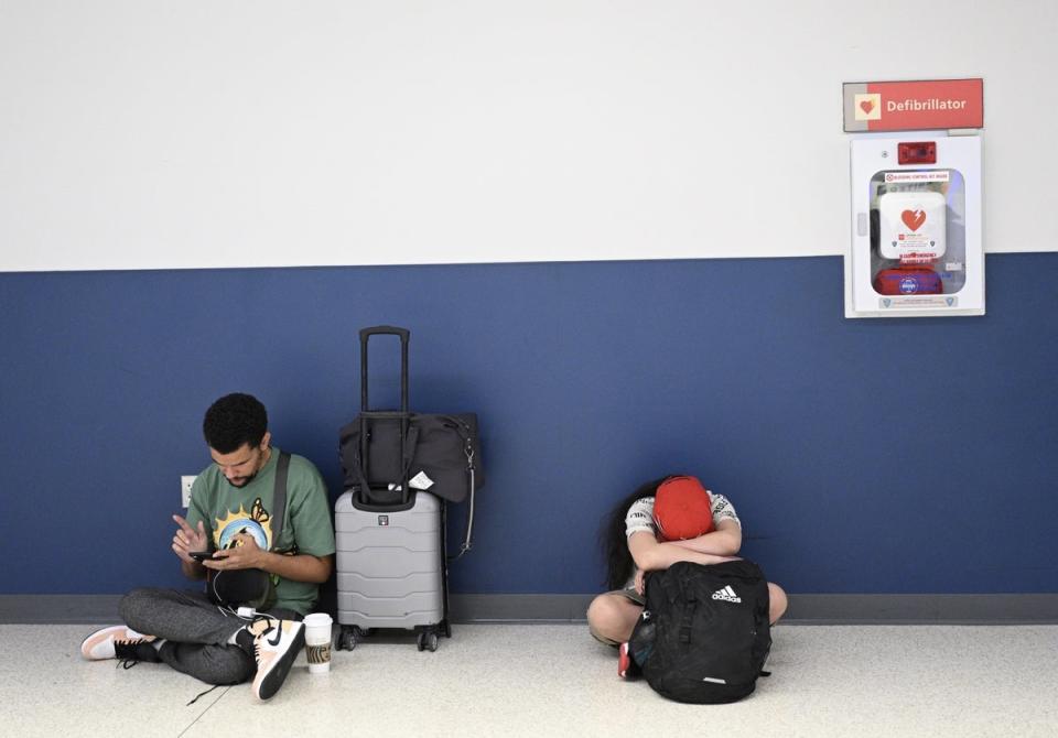 Passengers wait at the Newark Liberty International Airport as more than 2000 flights were canceled due to the nationwide storm in New Jersey this past week (Anadolu Agency via Getty Images)