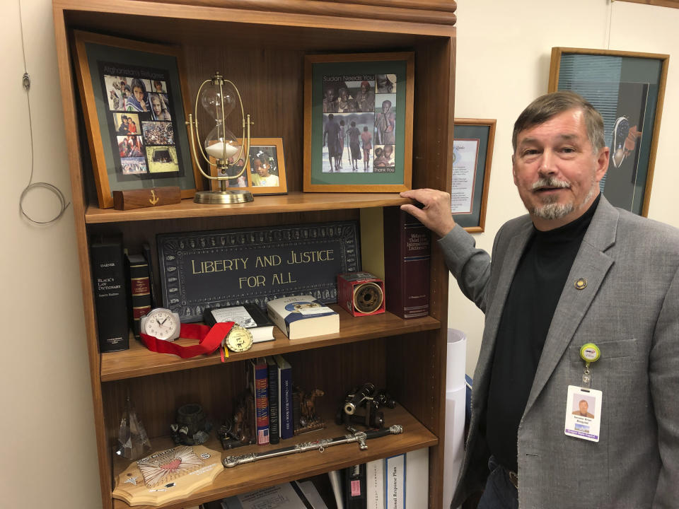 In this photo taken Wednesday, July 3, 2019, Oregon Sen. Brian Boquist poses in his office in the Oregon State Capitol in Salem, Ore., after an interview with The Associated Press. Boquist once worked in the world's hotspots as a military contractor and soldier and now finds himself under fire, this time from fellow lawmakers and the governor after he threatened state police and the Senate president ahead of a walkout by Republican lawmakers. A Senate special committee on conduct will hold a hearing Monday, July 8, 2019, over Sen. Boquist's behavior. (AP Photo/Andrew Selsky)