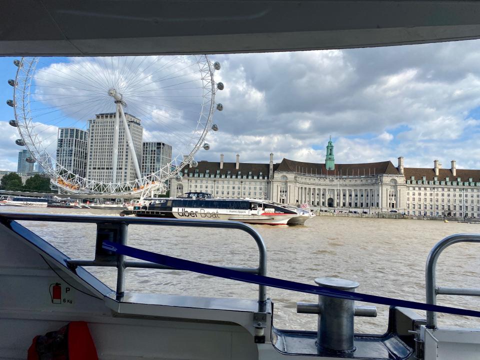 Uber Boat driving past London Eye