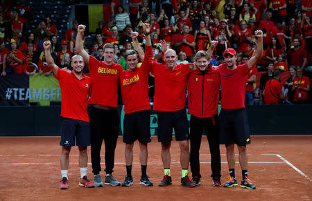 Tennis - Davis Cup - Semi-Finals - Belgium vs Australia - Palais 12, Brussels, Belgium - September 17, 2017 Belgium's David Goffin and Steve Darcis celebrate with team after winning the semi finals REUTERS/Yves Herman