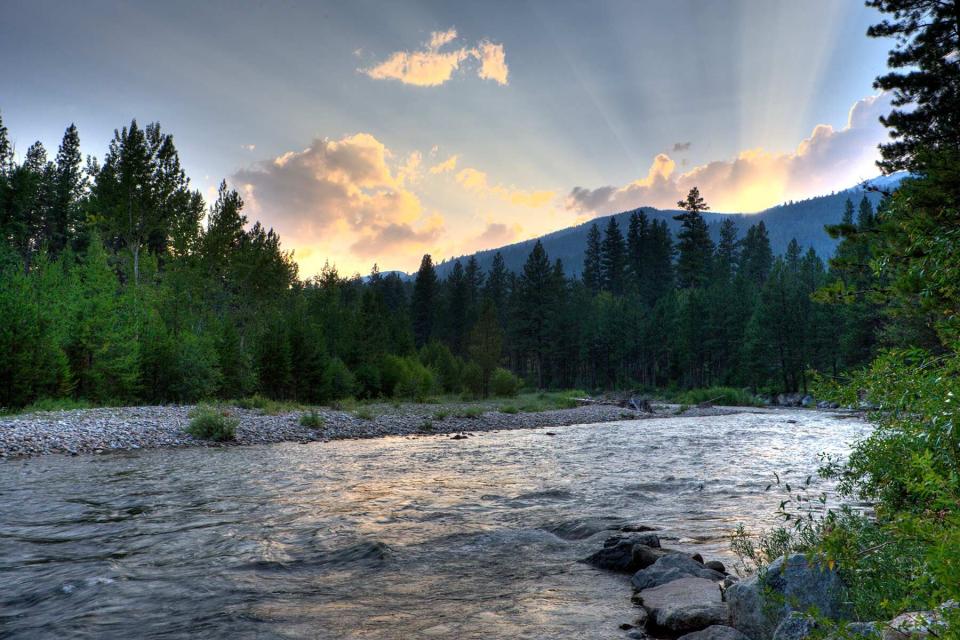 Sun rays over the river in Hamilton, Montana