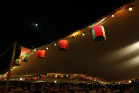 Lanterns hang at an outdoor restaurant to celebrate the Chinese Mid-Autumn Festival in Hong Kong Sunday, Sept. 30, 2012. Like ancient Chinese poets, Hong Kong people appreciate the beauty of the full moon in the Mid-Autumn Festival. (AP Photo/Vincent Yu)