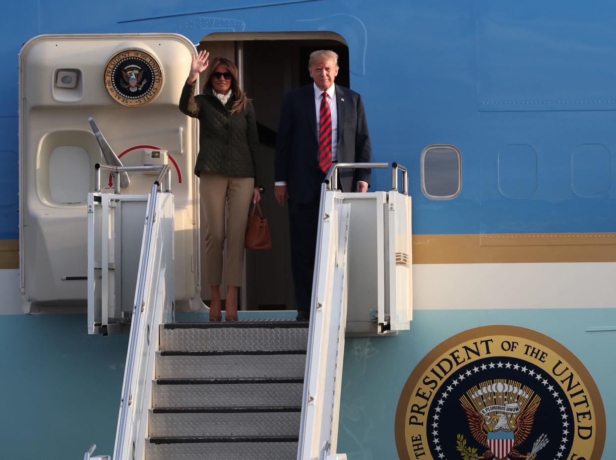 Donald and Melania Trump walking off Air Force One.