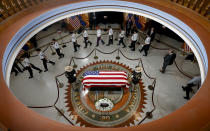 <p>Veterans walk past the casket of Sen. John McCain, R-Ariz. at the Arizona Capitol on Wednesday, Aug. 29, 2018, in Phoenix. (Photo: Ross D. Franklin, Pool/AP) </p>