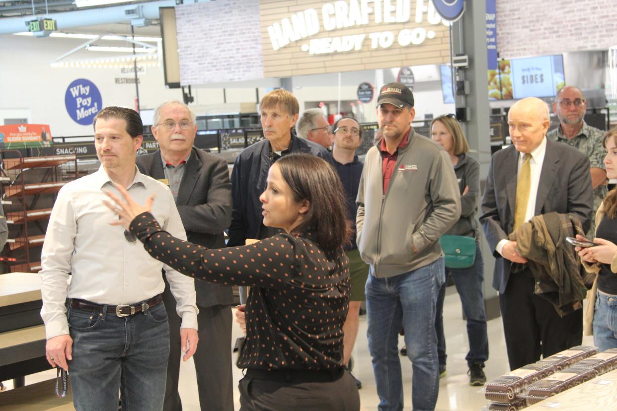 Hillsdale Meijer Store Director Kelli Quintana guides a group of VIPs on a tour of the Hillsdale Meijer May 7.