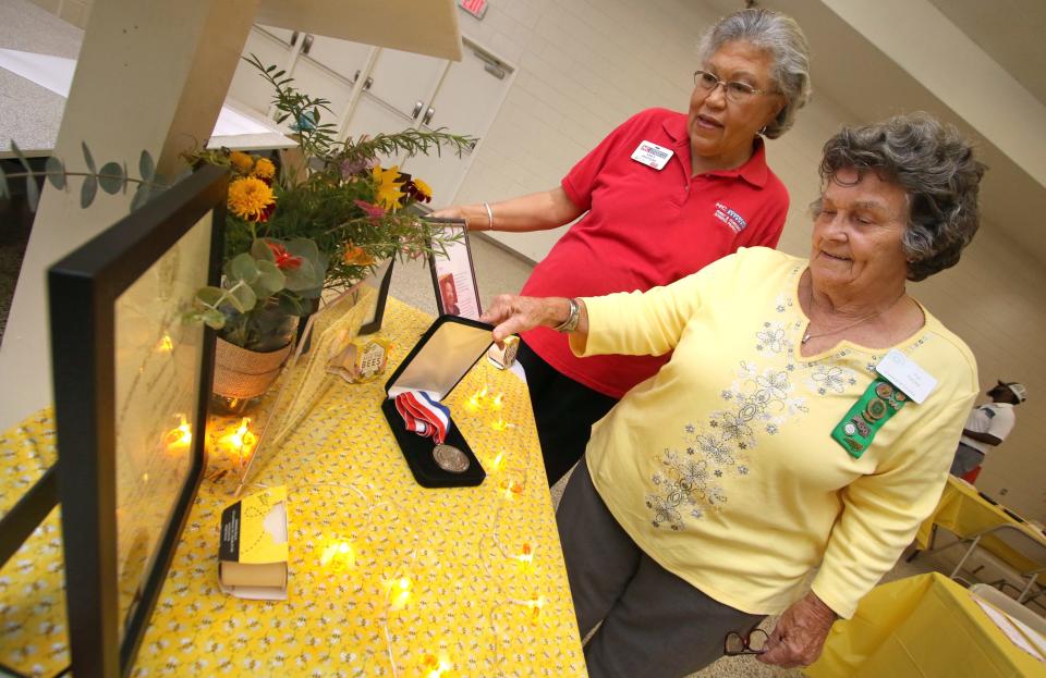 Nancy Abasiekong and Pat Farley look over one of many displays during the Cleveland County Extension & Community Association Achievement Luncheon held Thursday, August 25, 2022, at the NC Cooperative Extension Center in Shelby.