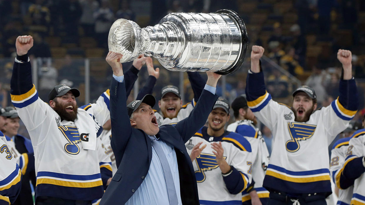 St. Louis Blues head coach Craig Berube carries the Stanley Cup after the Blues defeated the Boston Bruins in Game 7 of the NHL Stanley Cup Final, Wednesday, June 12, 2019, in Boston. (AP Photo/Michael Dwyer)