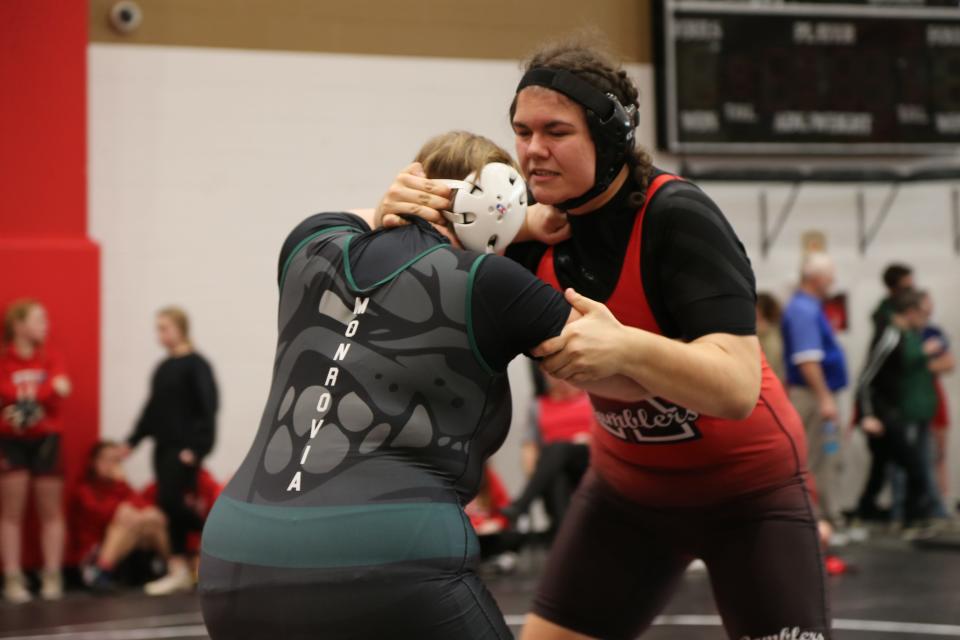 Attica sophomore Aubrey Bartkowiak (right) grapples Portia Weaver of Monrovia at Clinton Prairie High School on Saturday, Nov. 18, 2023.