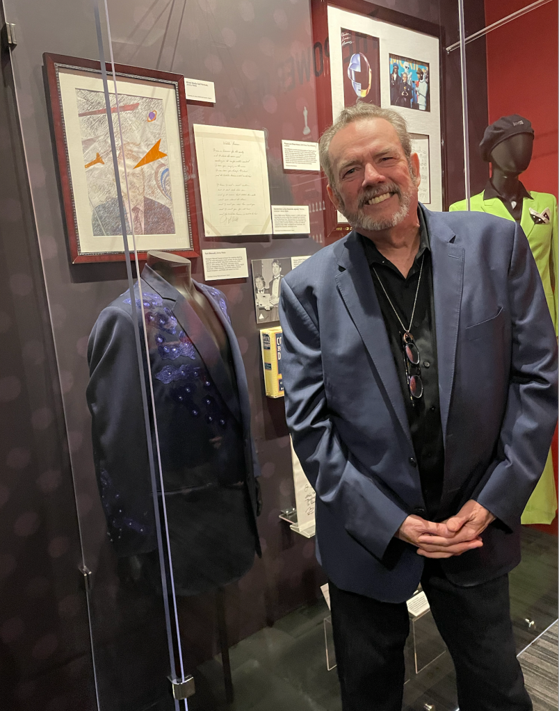 Jimmy Webb in front of a display of his costuming and material at the Grammy Museum (Chris Willman/Variety)
