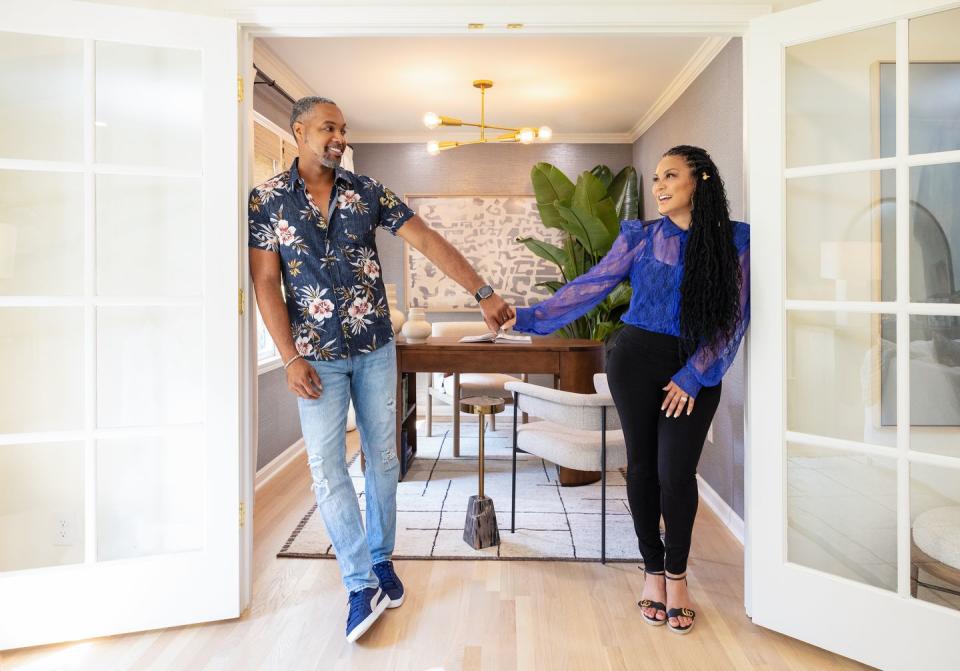 as seen on married to real estate, husband and wife duo, mike jackson and egypt sherrod, pose together in the newly renovated jeske office space in atlanta, georgia