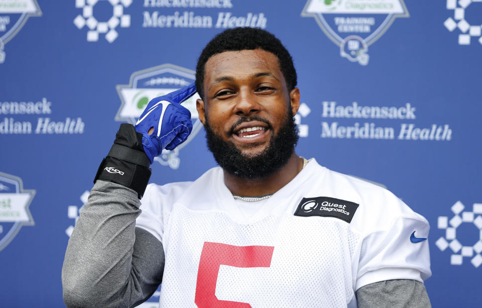 FILE - New York Giants' Kayvon Thibodeaux (5) answers questions from media at the NFL football team's rookie minicamp in East Rutherford, N.J., Friday, May 13, 2022. New York has talent on defense with Leonard Williams, Azeez Ojulari and Thibodeaux. (AP Photo/Noah K. Murray, File)