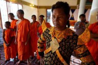 A dancer gets ready before a performance of masked theatre known as Lakhon Khol, which was recently listed by UNESCO, the United Nations' cultural agency, as an intangible cultural heritage, along with neighbouring Thailand's version of the dance, known as Khon at the Wat Svay Andet Buddhist temple in Kandal province, Cambodia December 16, 2018. REUTERS/Samrang Pring