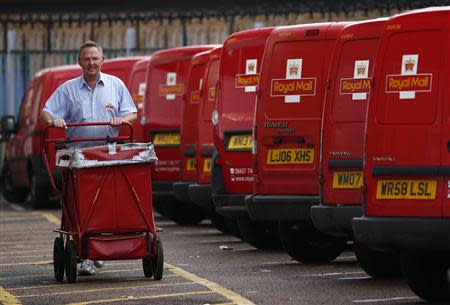 A postal worker pushes a cart at a Royal Mail sorting office in Loughborough, central England, September 12, 2013. REUTERS/Darren Staples