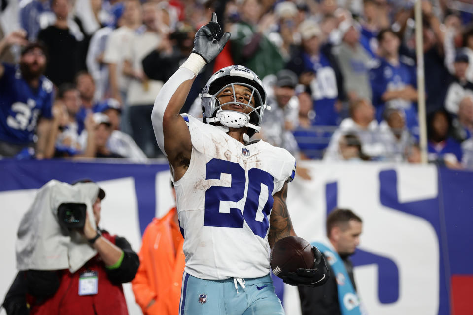 Dallas Cowboys' Tony Pollard celebrates after scoring a touchdown during the second half of an NFL football game against the New York Giants, Sunday, Sept. 10, 2023, in East Rutherford, N.J. (AP Photo/Adam Hunger)