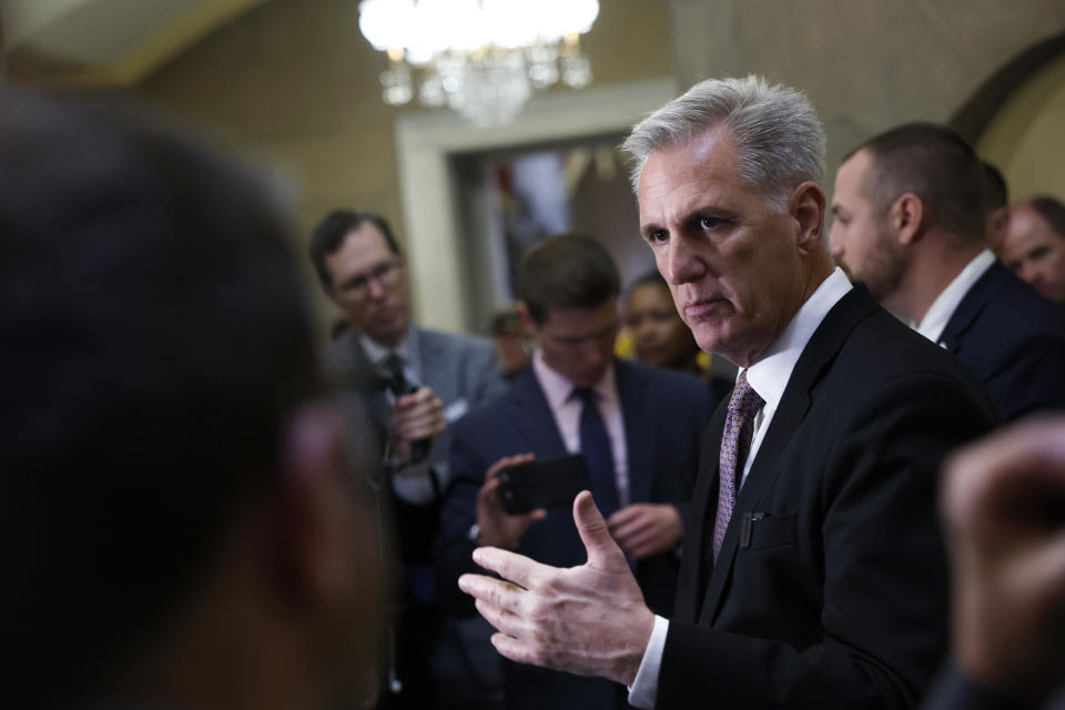 House Speaker Kevin McCarthy speaks to reporters outside his office.