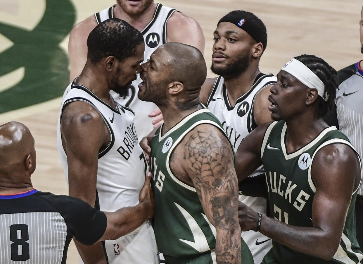 Jun 10, 2021; Milwaukee, Wisconsin, USA; Milwaukee Bucks forward P.J. Tucker (17) yells in the face of Brooklyn Nets forward Kevin Durant (7) in the third quarter during game three in the second round of the 2021 NBA Playoffs at Fiserv Forum. Mandatory Credit: Benny Sieu-USA TODAY Sports