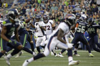 Denver Broncos quarterback Teddy Bridgewater (5) looks for a receiver during the first half of an NFL preseason football game against the Seattle Seahawks on Saturday, Aug. 21, 2021, in Seattle. (AP Photo/Jason Redmond)