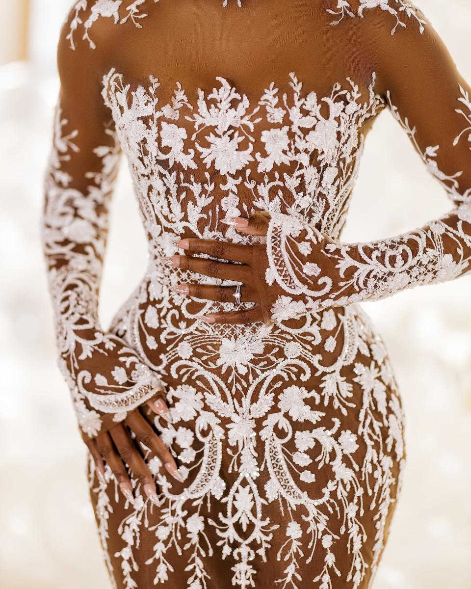 A close-up shot of a lace wedding dress.