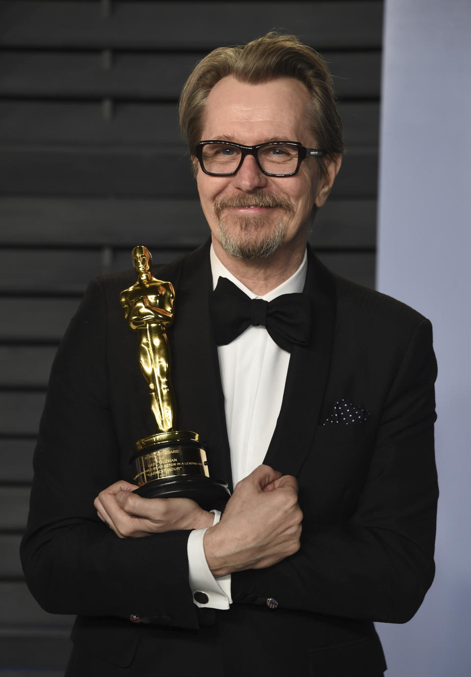 Gary Oldman, winner of the award for best performance by an actor in a leading role for “Darkest Hour”, arrives at the Vanity Fair Oscar Party on Sunday, March 4, 2018, in Beverly Hills, Calif. (Photo by Evan Agostini/Invision/AP)