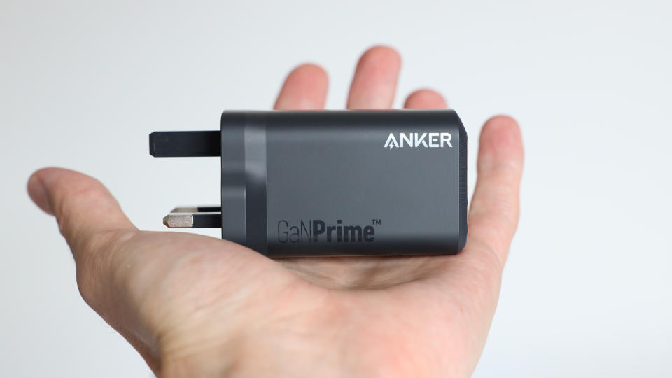 Anker Prime 100W charger held in a hand