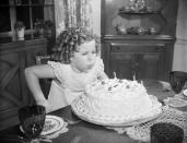 <p>On the eve of her 9th birthday, the film star was photographed in her family home blowing out the candles on her birthday cake. </p>