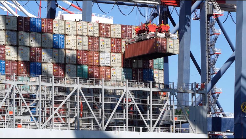 Cargo containers are offloaded from a ship in the Port of Long Beach, Calif.