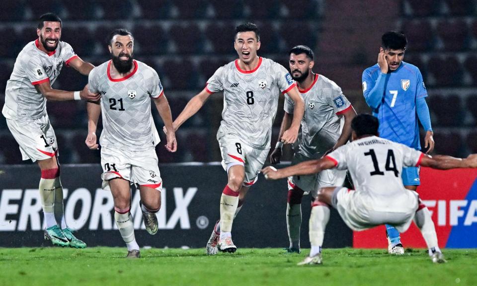 <span>Afghanistan's Sharif Mukhammad (second from left) celebrates with teammates after scoring the late winner against India in Guwahati on Tuesday.</span><span>Photograph: Biju Boro/AFP/Getty Images</span>