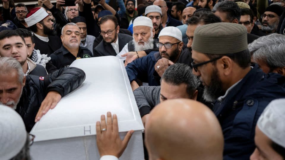 Mourners surround the casket of Wadea Al-Fayoume after a funeral prayer for the 6-year-old Muslim boy in Bridgeview, Illinois, on October 16, 2023. According to police Wadea was stabbed to death in an attack that targeted him and his mother for their religion and as a response to the war between Israel and Hamas. - Jim Vondruska/Reuters