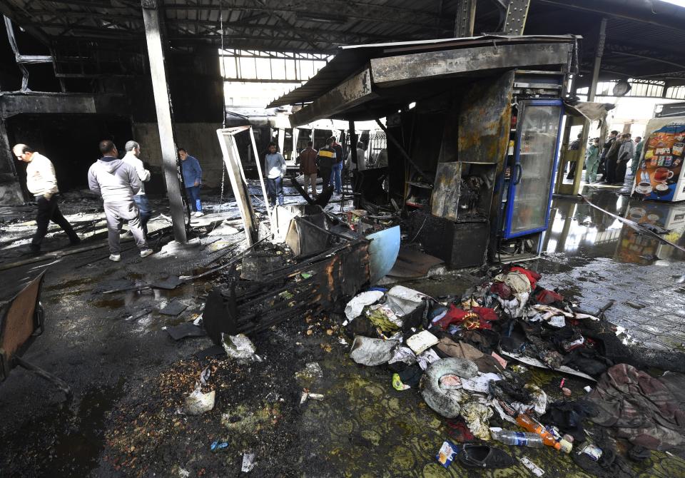 Charred objects are scattered on the ground around Cairo’s main train station. (KHALED DESOUKI/AFP/Getty Images)