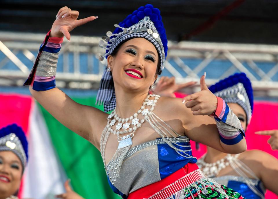 Jubilyn Le performs with the Nkauj Plhis Txuj dance group in the dance competition at the Stockton Hmong New Year Festival at the 99 Speedway in Stockton on Saturday, Nov. 12, 2022. 