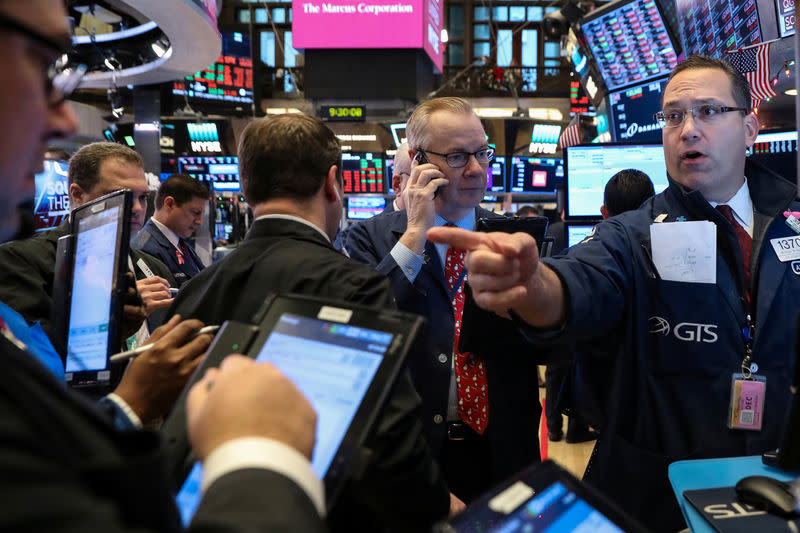Traders work on the floor of the New York Stock Exchange (NYSE) in New York, U.S., December 14, 2018. REUTERS/Brendan McDermid