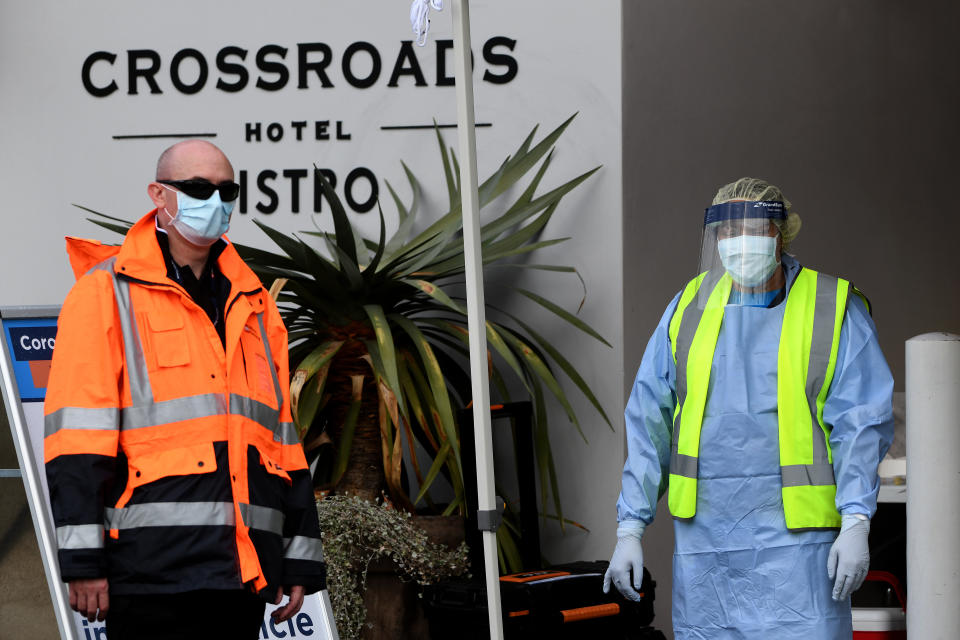 NSW Health workers and security at Crossroads Hotel in Sydney.