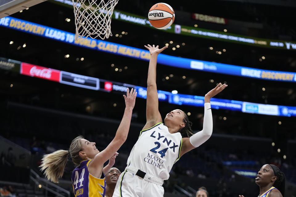 Minnesota Lynx forward Napheesa Collier (24) shoots as Los Angeles Sparks Karlie Samuelson (44) defends during the first half of a WNBA basketball game Tuesday, June 20, 2023, in Los Angeles. (AP Photo/Mark J. Terrill)