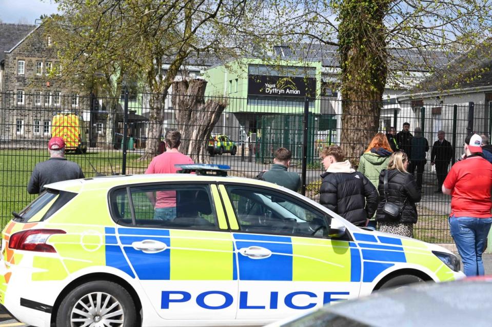 Parents waited hours at the gates of the school, which was “in lockdown”, before being tearfully reunited with their children hours later (Robert Melen/Shutterstock)