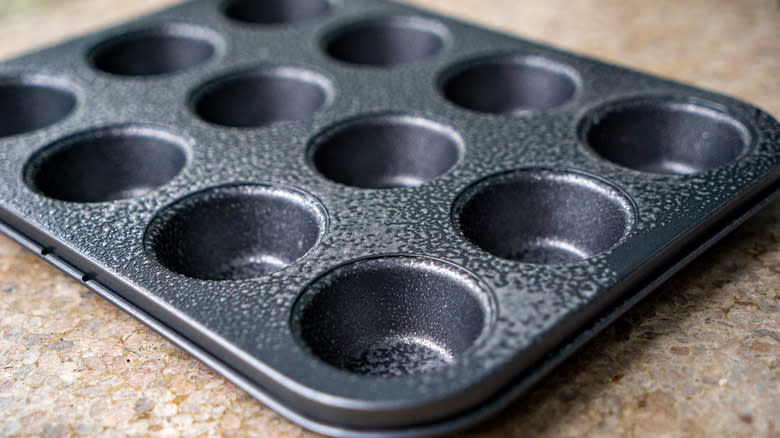 Greased muffin tin