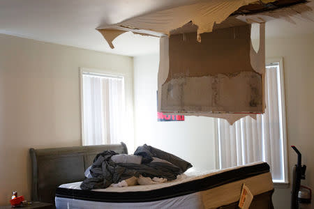 A collapsed ceiling is shown in the house of a Marine and his family whose home suffered severe damage post-Hurricane Florence at Marine Corps Base Camp Lejeune, North Carolina, U.S., September 27, 2018. REUTERS/Andrea Januta