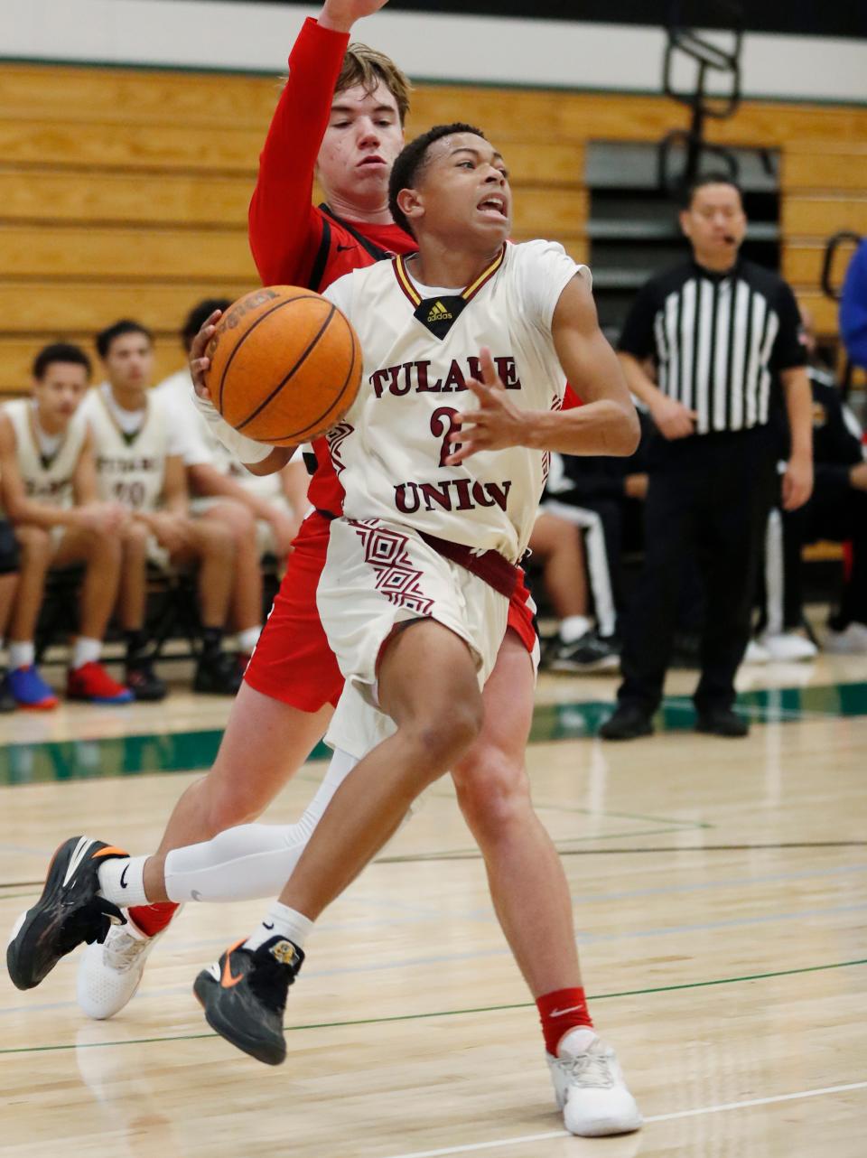 Tulare Union's Demaje Riley goes in for a layup against Kerman during the Gonzalo Carrasco Memorial Varsity Boys Basketball Tournament at Reedley High School on Saturday, Jan. 6, 2024.