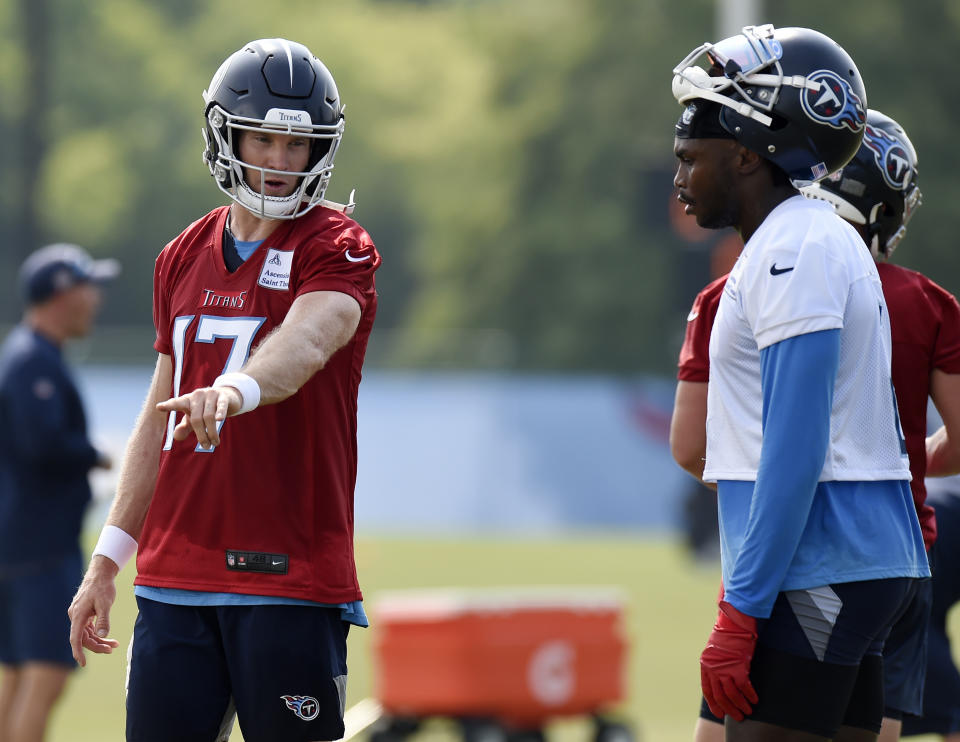 Tennessee Titans quarterback Ryan Tannehill (17) talks with wide receiver Julio Jones (2) during NFL football training camp Thursday, July 29, 2021, in Nashville, Tenn. (AP Photo/Mark Zaleski)