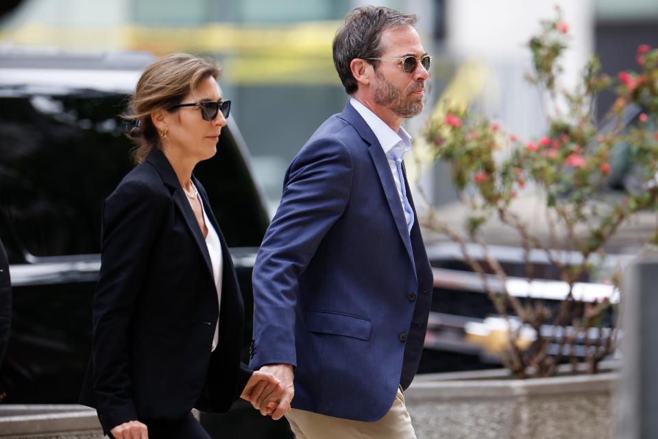 Hallie Biden (left) walks with her husband John Hopkins Anning (right) to federal court on Thursday June 6 (Getty Images)