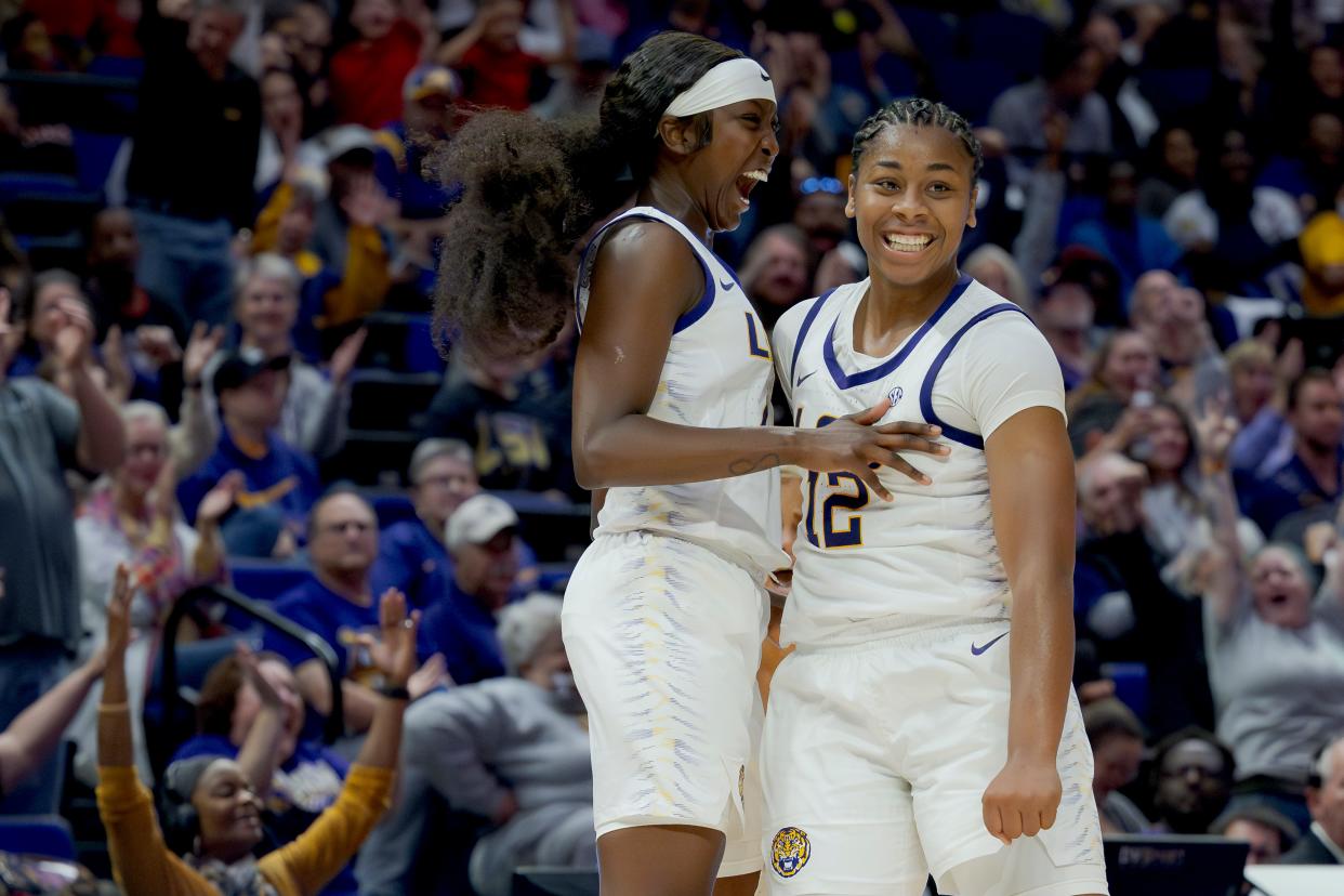 LSU guard Mikaylah Williams (12) celebrates a second-half 3-pointer with Flau'jae Johnson against Kent State on Tuesday, Nov. 14, 2023, in Baton Rouge, La.
