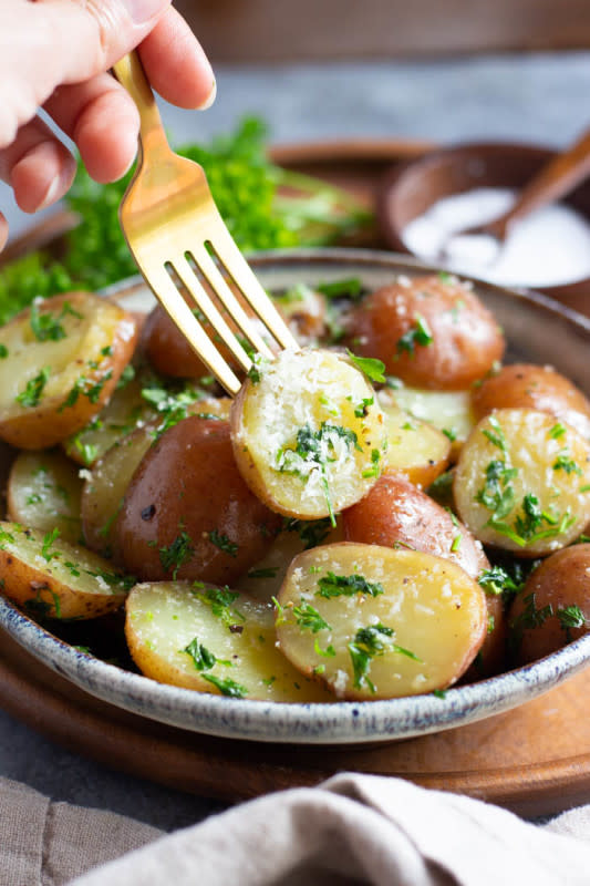 <p>Easy Potato Recipes</p><p>Rich buttered parsley potatoes are so easy to make. Small red potatoes mixed with butter and fresh parsley make the perfect side dish.</p><p><strong>Get the recipe: <a href="https://easypotatorecipes.com/easy-buttered-parsley-potatoes-recipe/" rel="nofollow noopener" target="_blank" data-ylk="slk:Easy Buttered Parsley Red Potatoes;elm:context_link;itc:0;sec:content-canvas" class="link rapid-noclick-resp">Easy Buttered Parsley Red Potatoes</a></strong></p>