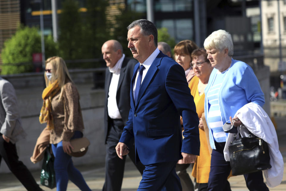 Son John Taggart and other family members of Daniel who was shot, arrive for the inquest into the Ballymurphy shooting, in Belfast, Northern Ireland, Tuesday May 11, 2021. The findings of the inquest into the deaths of 10 people during an army operation in August 1971 is due to be published on Tuesday. (AP Photo/Peter Morrison)