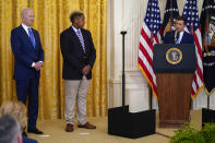 President Joe Biden stands with Ashton Mota, of the GenderCool Project, as Transportation Secretary Pete Buttigieg speaks during an event to commemorate Pride Month, in the East Room of the White House, Friday, June 25, 2021, in Washington. (AP Photo/Evan Vucci)