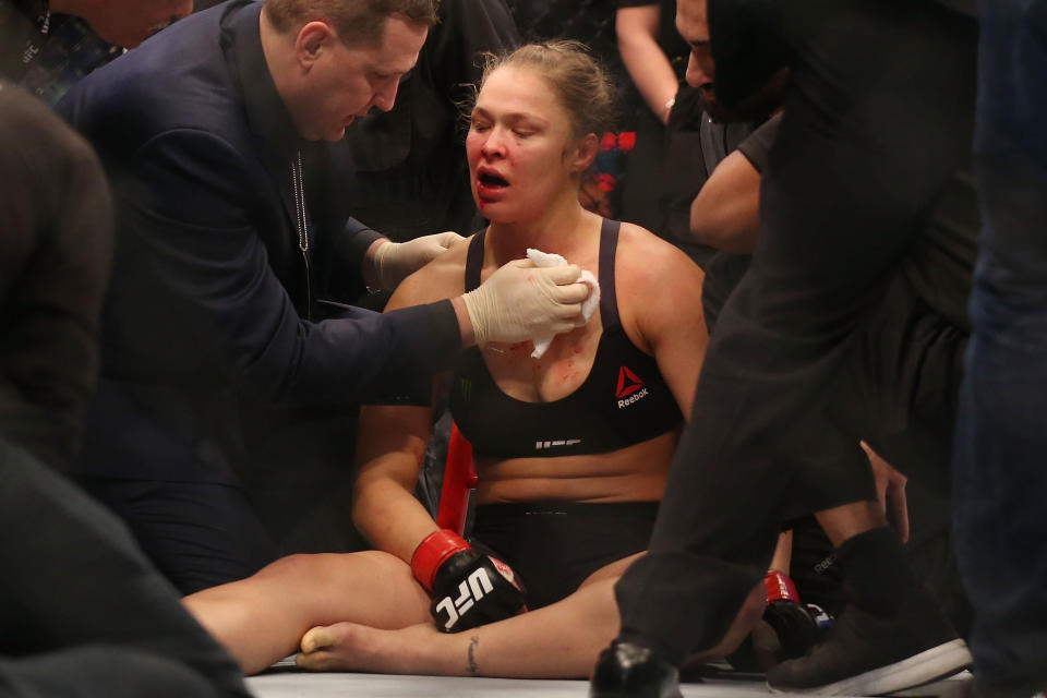 MELBOURNE, AUSTRALIA - NOVEMBER 15:  Ronda Rousey of the United States receives medical treatment after being defeated by Holly Holm of the United States in their UFC women's bantamweight championship bout during the UFC 193 event at Etihad Stadium on November 15, 2015 in Melbourne, Australia.  (Photo by Quinn Rooney/Getty Images)