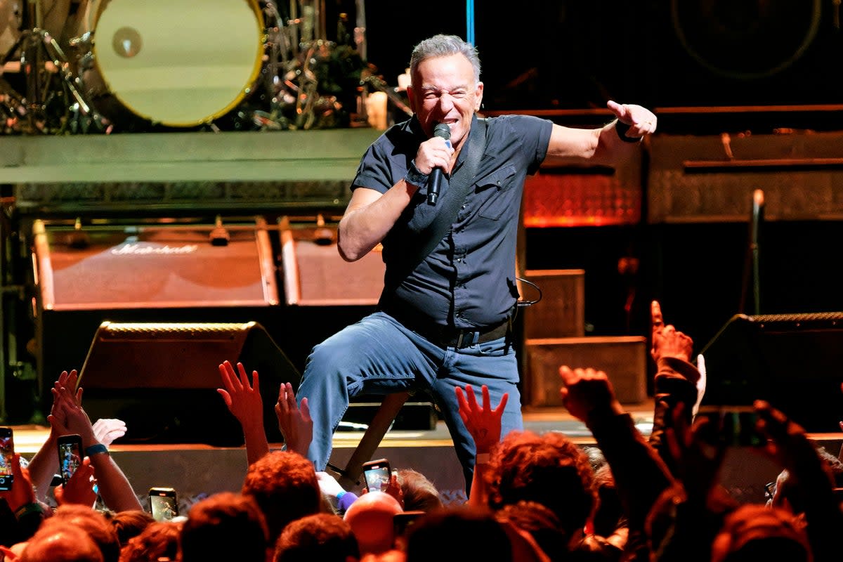 Bruce Springsteen and the E Street Band performing in 2023 (Rob Grabowski/Invision/AP)