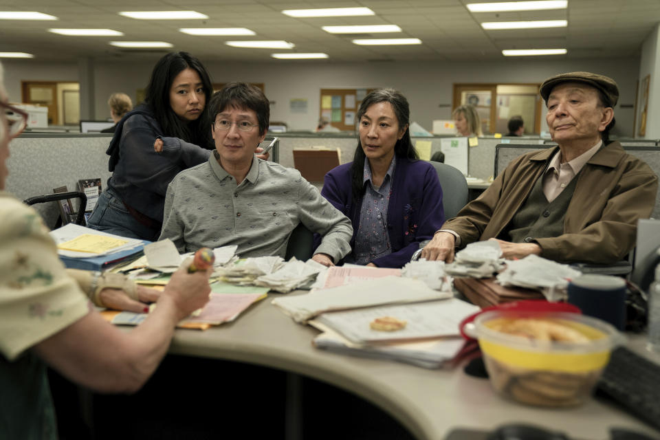 This image released by A24 Films shows, from left, Stephanie Hsu, Ke Huy Quan, Michelle Yeoh and James Hong in a scene from "Everything Everywhere All at Once." (Allyson Riggs/A24 via AP)